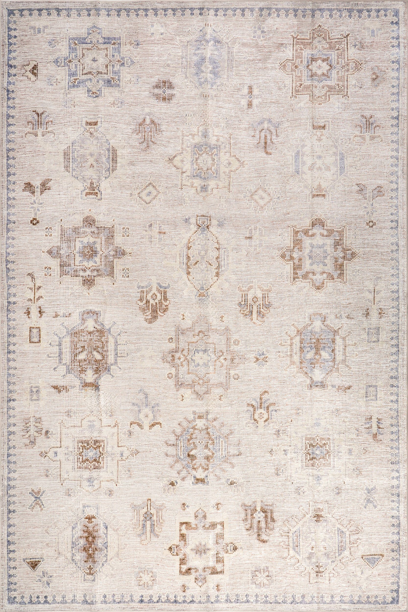 a80d0502186e44b6f9df9857bb0aa5f037564b7c Isolated view of Beige Round Brenda Hazy Heraldry Spill Proof Washable Rug, showcasing its design